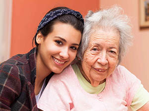 younger-woman-smiling-with-older-woman